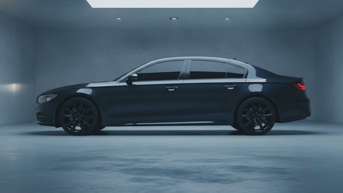A dark sedan with deeply tinted side windows in a dim garage